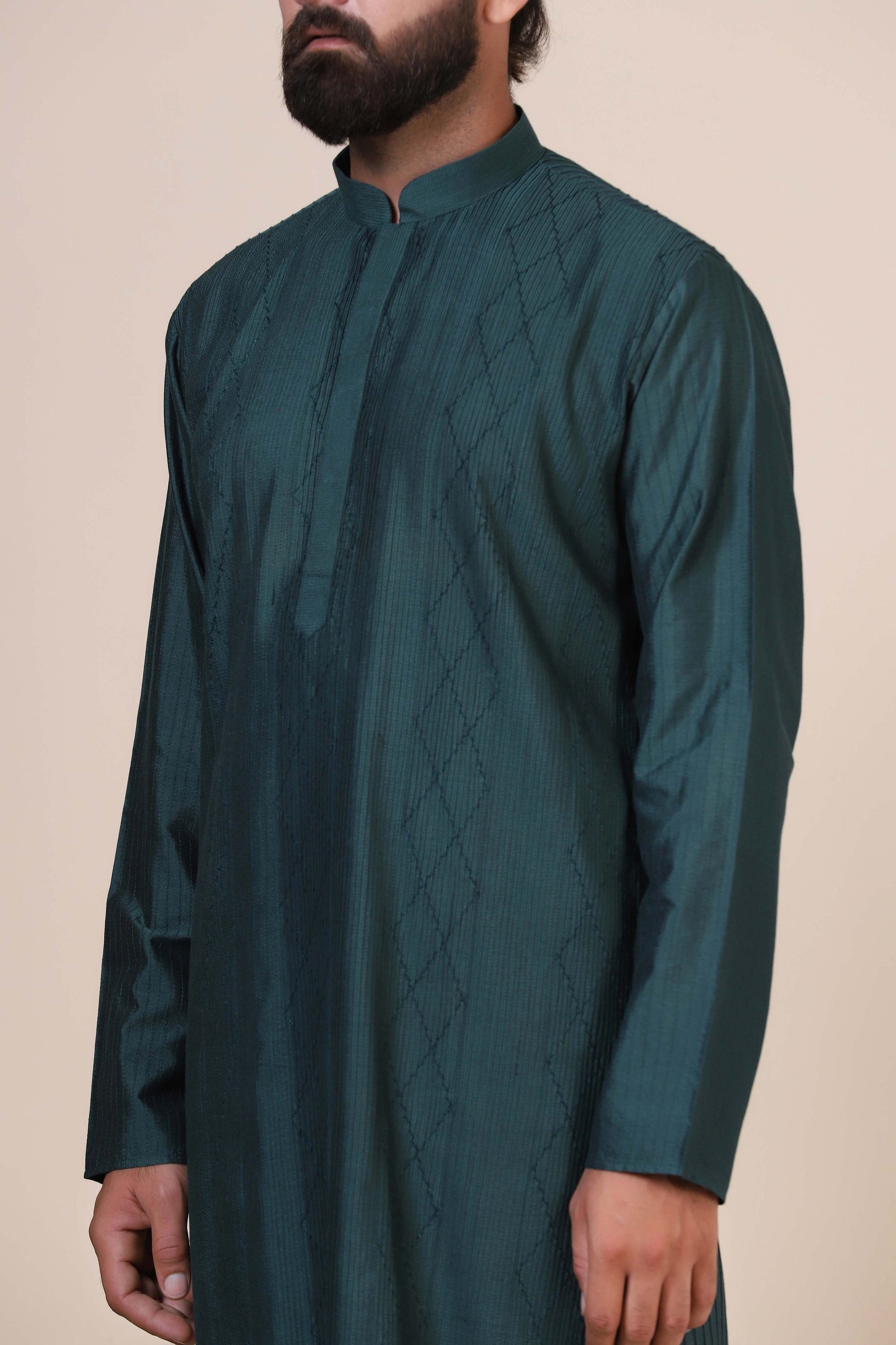 Experience comfort  in Green kurta pajama, crafted from blended cotton and silk fabric. Shop Now!