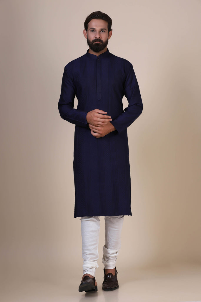 Indulge in comfort and elegance with our Navy kurta pajama, crafted from blended cotton and silk fabric. Delicate Pintucks adorn the front, adding a touch of sophistication.
