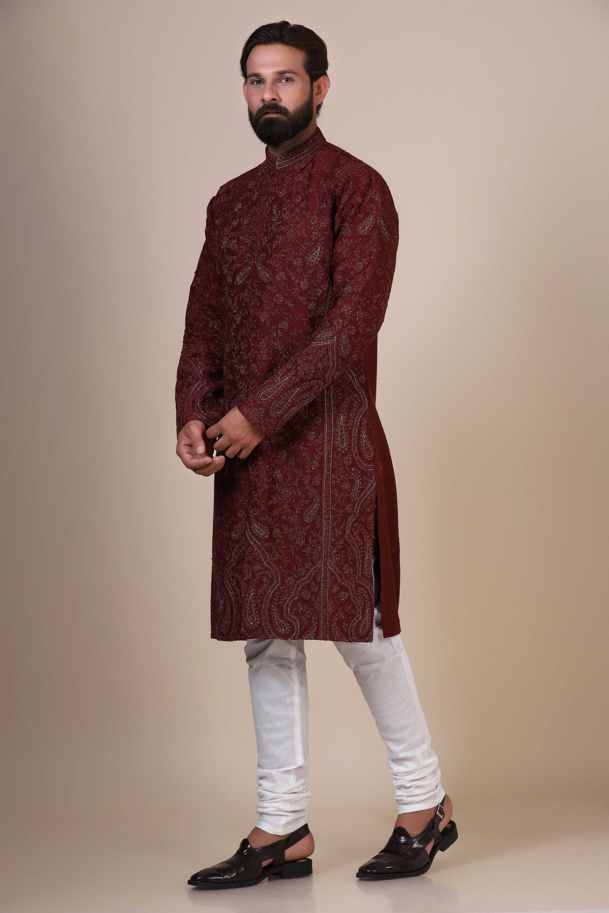 Elegance meets tradition in this maroon Kurta adorned with heavy silver embroidery. Shop Now!