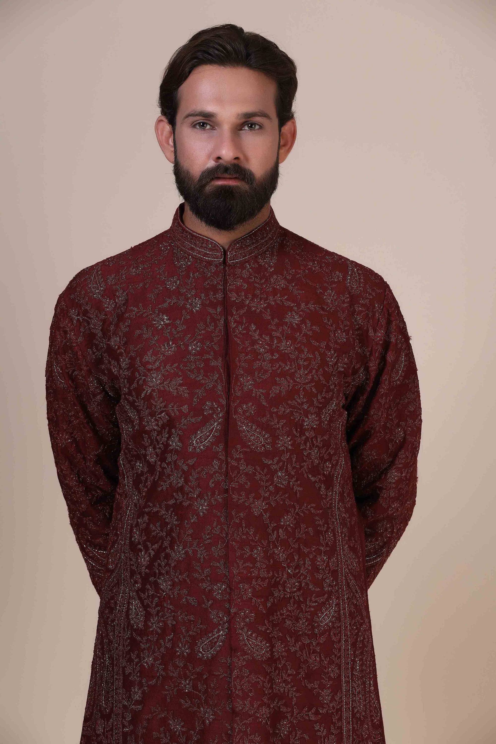 Elegance meets tradition in this maroon Kurta adorned with heavy silver embroidery. Shop Now!