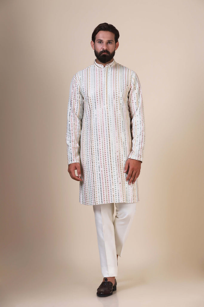 Step into elegance with this multicolour Kurta Pajama, crafted from cotton fabric and adorned with intricate chikankari embroidery throughout.