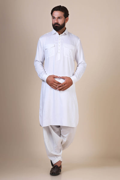 Crafted in flowing modal fabric, this White pathani suit exudes traditional charm with its collared neck, double chest pockets, and shoulder flaps.