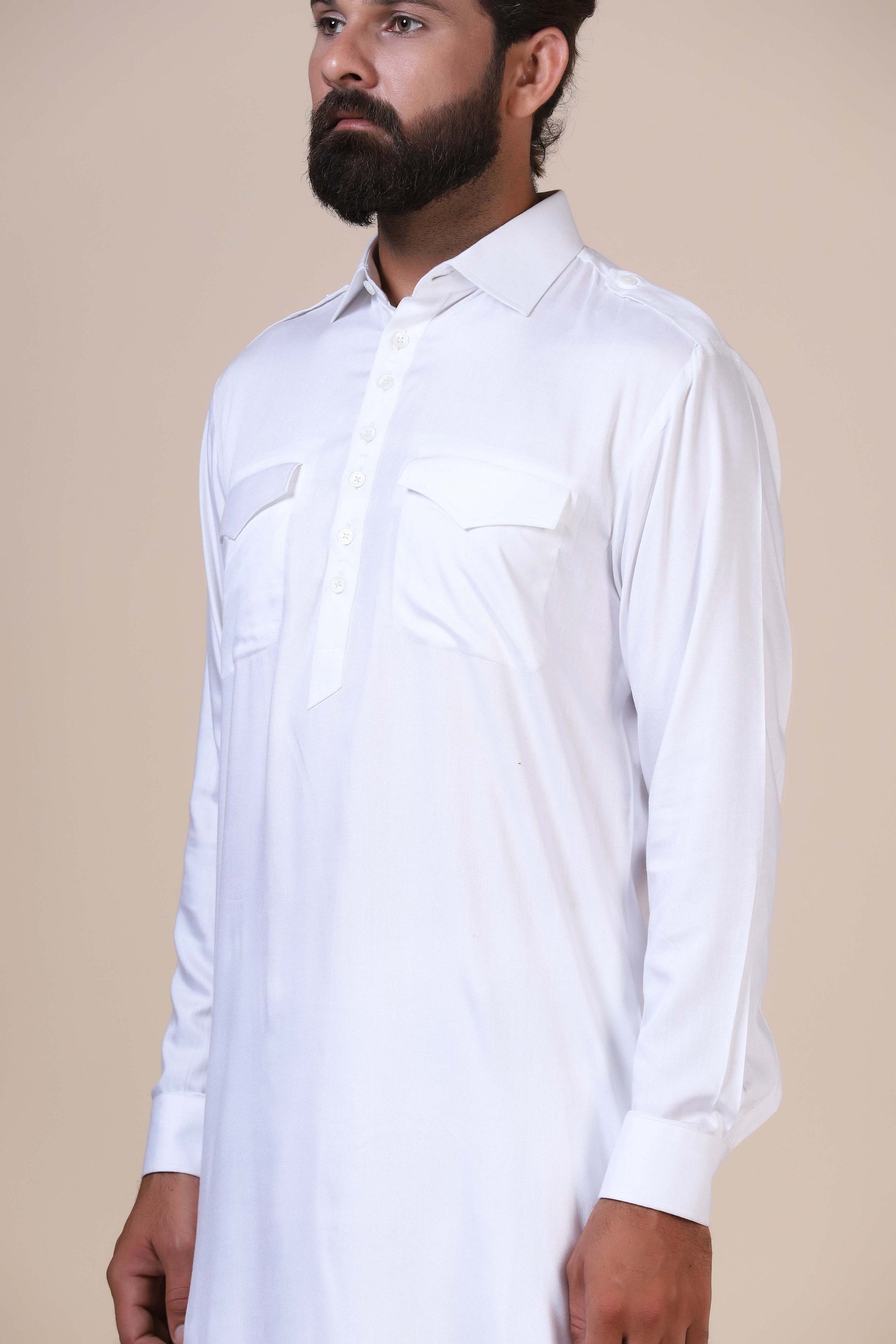 Crafted in flowing modal fabric, this White pathani suit exudes traditional charm. Shop Now!