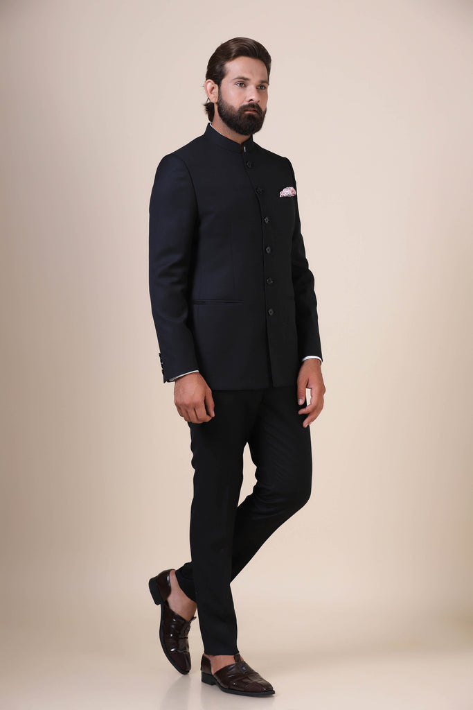 Elevate your style with our Basic Black Bandhgala suit, tailored from wool-rich fabric. Featuring a banned collar, 5-button closure, and tapered trousers for a refined look.