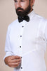 Tailored from premium cotton, this timeless white tuxedo shirt boasts vertical pintucks on the front, complemented by black buttons and a classic collar.