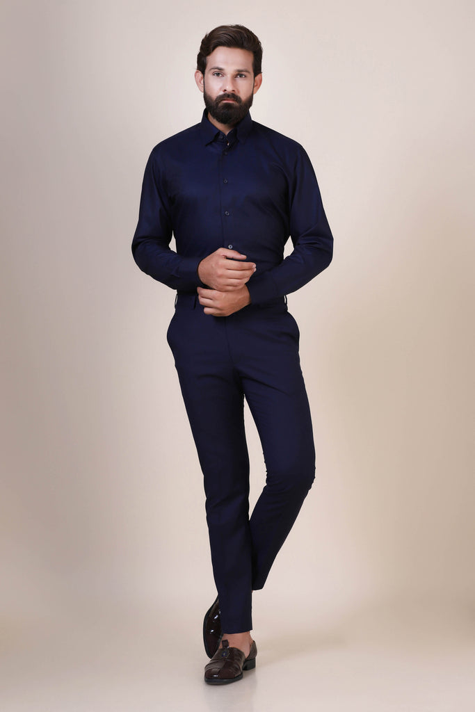 Stay effortlessly chic in our navy shirt crafted from 100% cotton. With a concealed button-down collar and French placket, it's a timeless wardrobe staple.