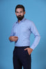 Elevate your style effortlessly with our 100% cotton blue shirt. Featuring a concealed button-down collar and French placket for a refined look.