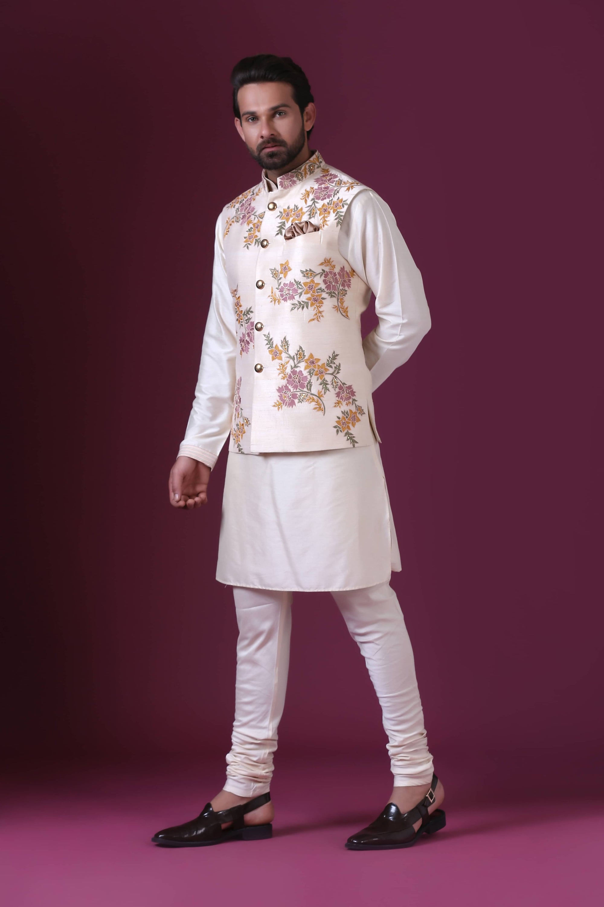 Exude elegance in our Ivory Nehru jacket with delicate floral embroidery. Shop Now!