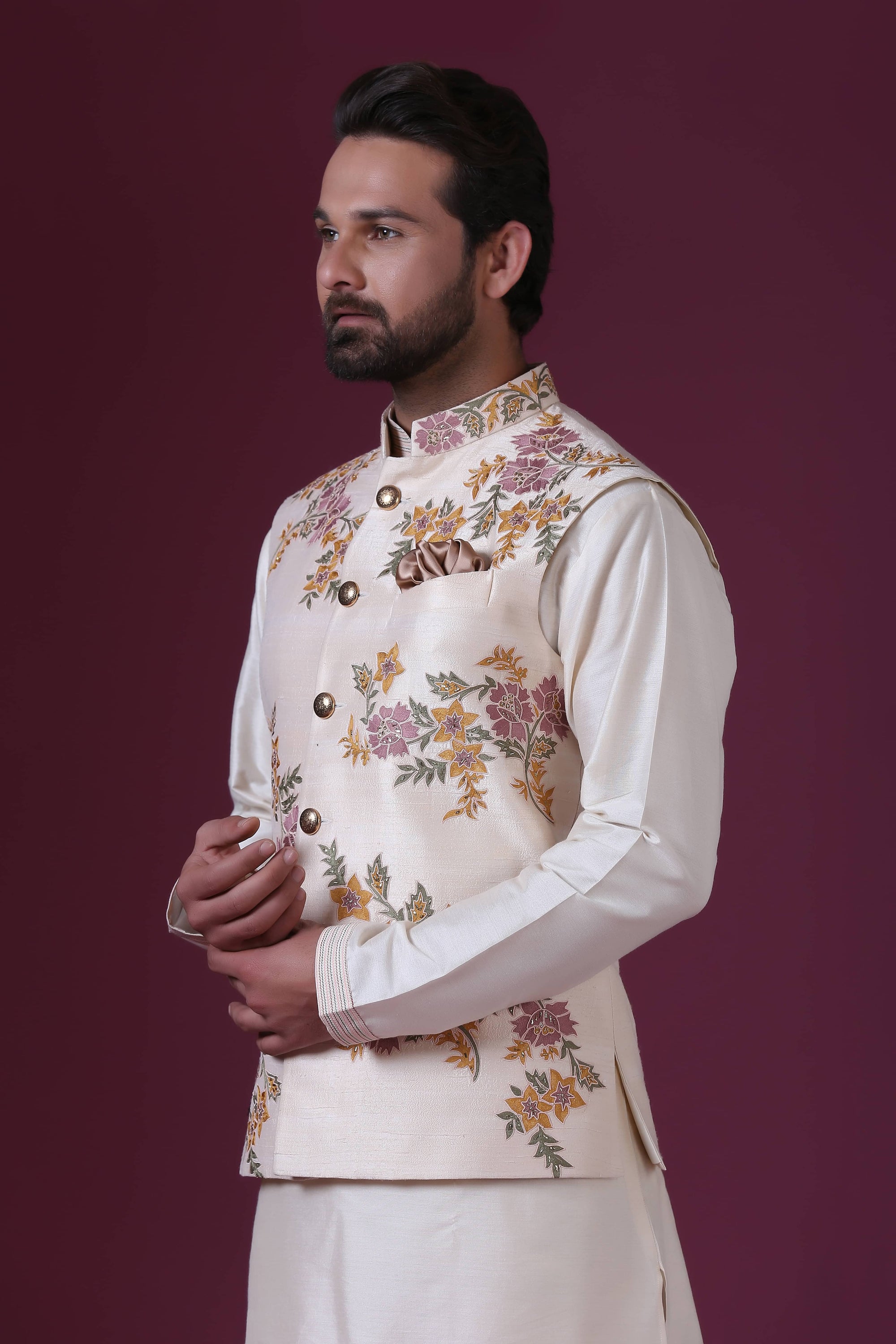 Exude elegance in our Ivory Nehru jacket with delicate floral embroidery. Shop Now!