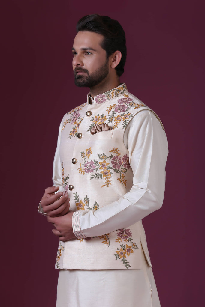 Exude elegance in our Ivory Nehru jacket with delicate floral embroidery, paired flawlessly with matching kurta pajama. Ideal for daytime weddings, a must-have for grooms.