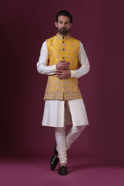 Indulge in exclusivity with our Haldi-colored Nehru Jacket set. Intricately adorned with Kiran Dori embroidery, crafted over 10 hours by our skilled artisans.