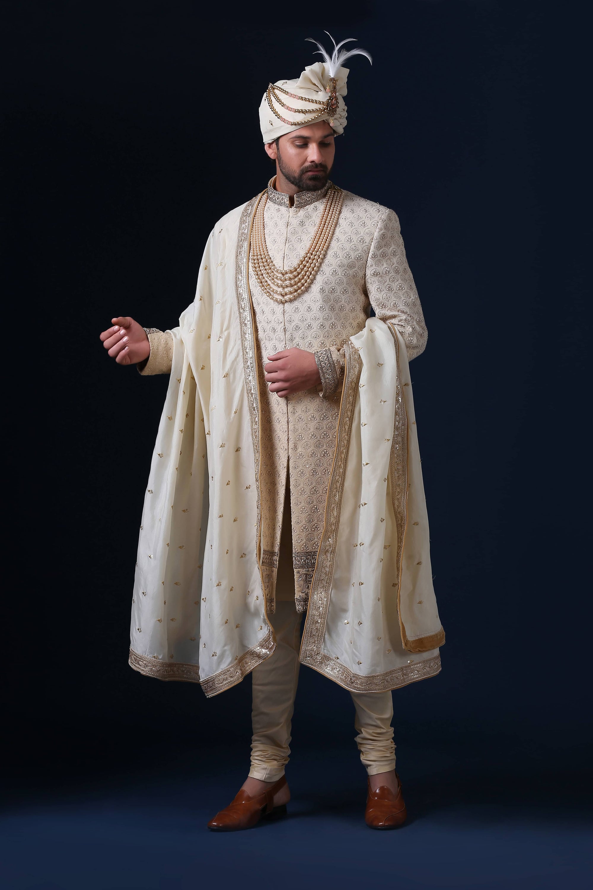 This is a Lucknowi Chikan Sherwani with an embroidery panel at the bottom. Shop Now!