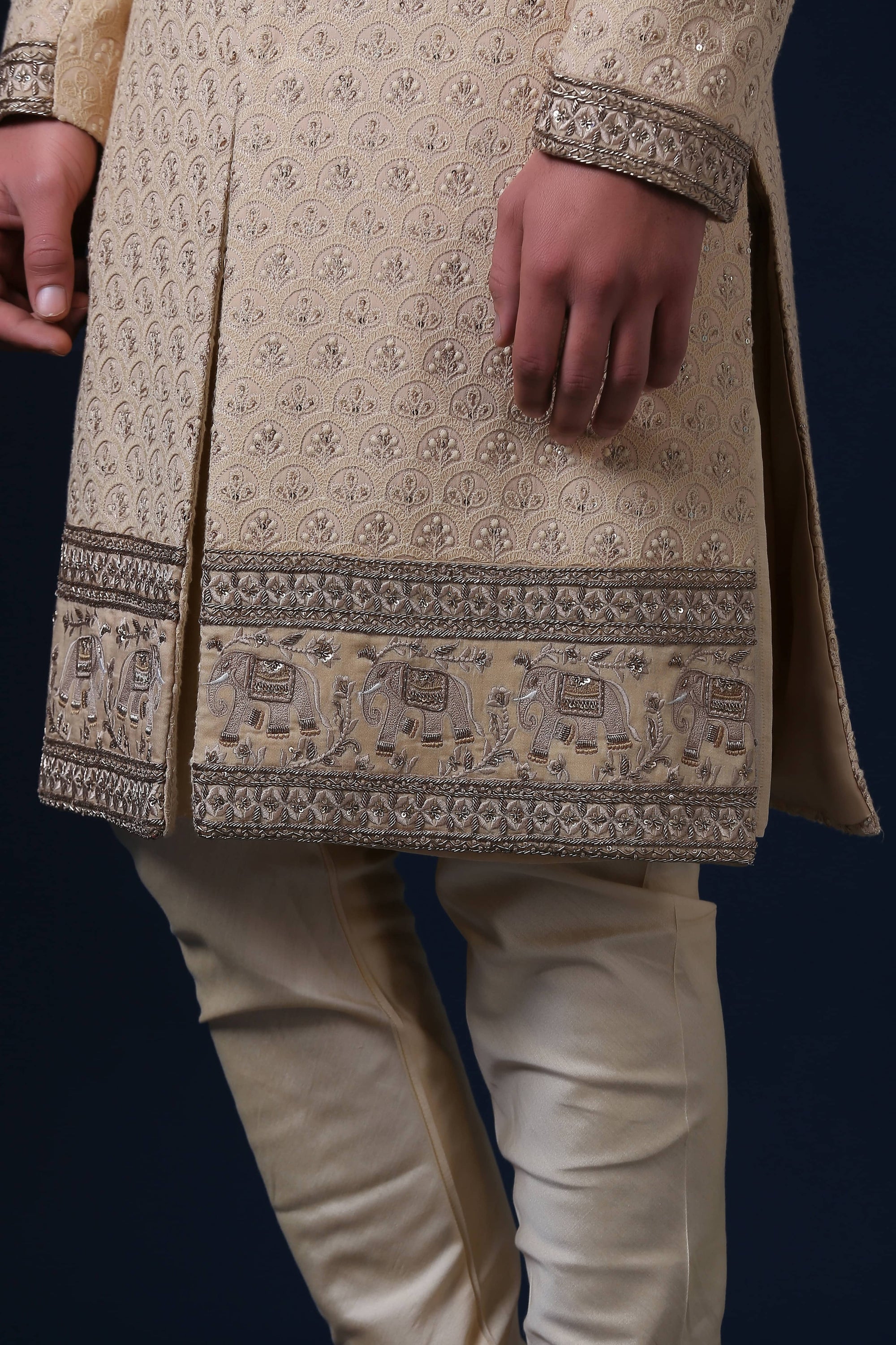 This is a Lucknowi Chikan Sherwani with an embroidery panel at the bottom. Shop Now!