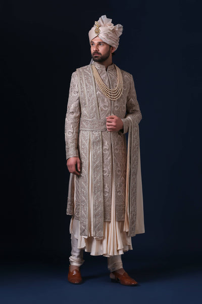 Experience luxury with our best-selling sherwani, featuring panelled patch-work and intricate thread embroidery.