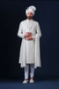 Timeless elegance embodied in this ivory Sherwani, adorned with tonal white embroidery. Complete with Kurta and Pajama. Accessories sold separately.