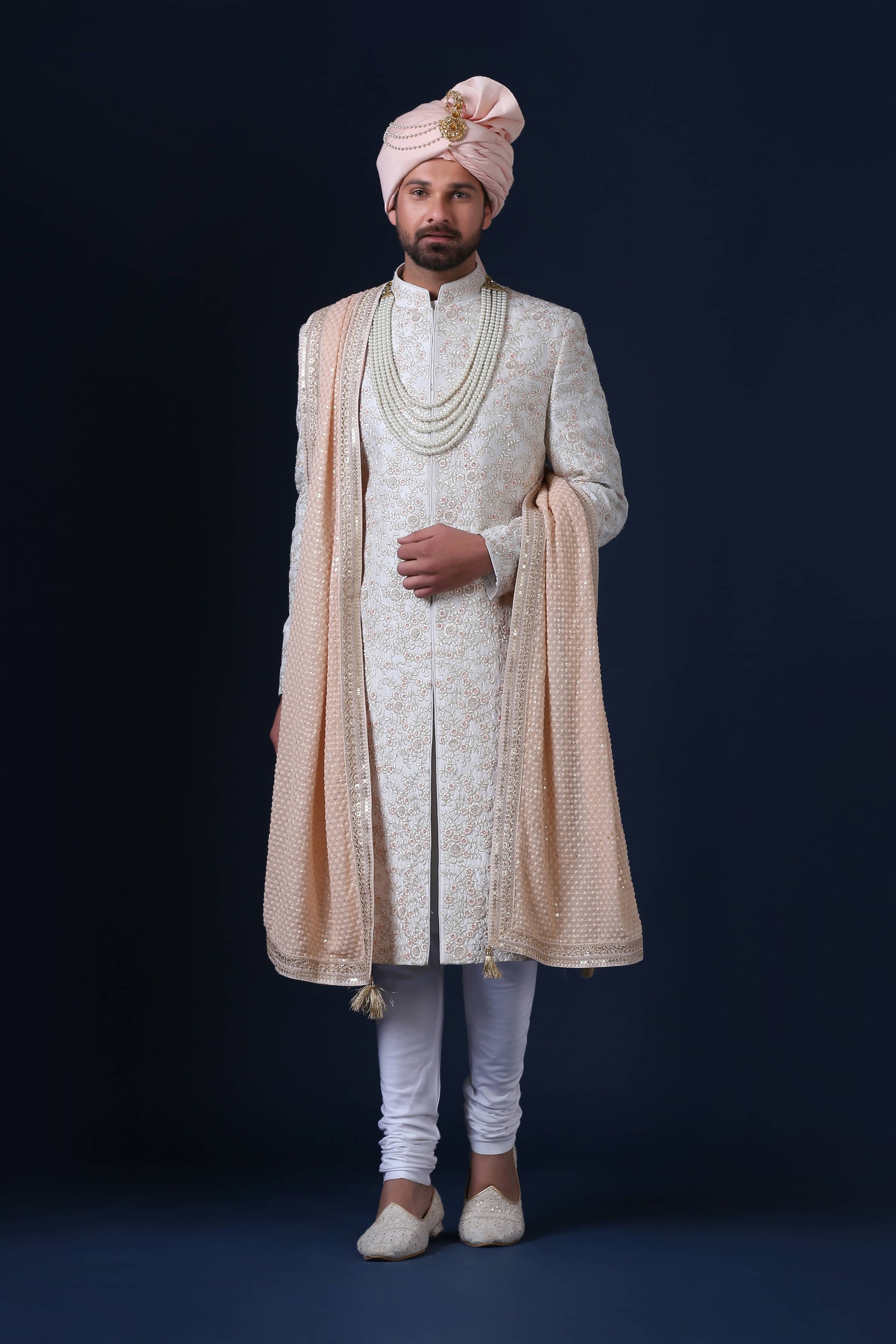 Elegantly adorned with floral embroidery, this Sherwani exudes timeless sophistication. Shop Now!
