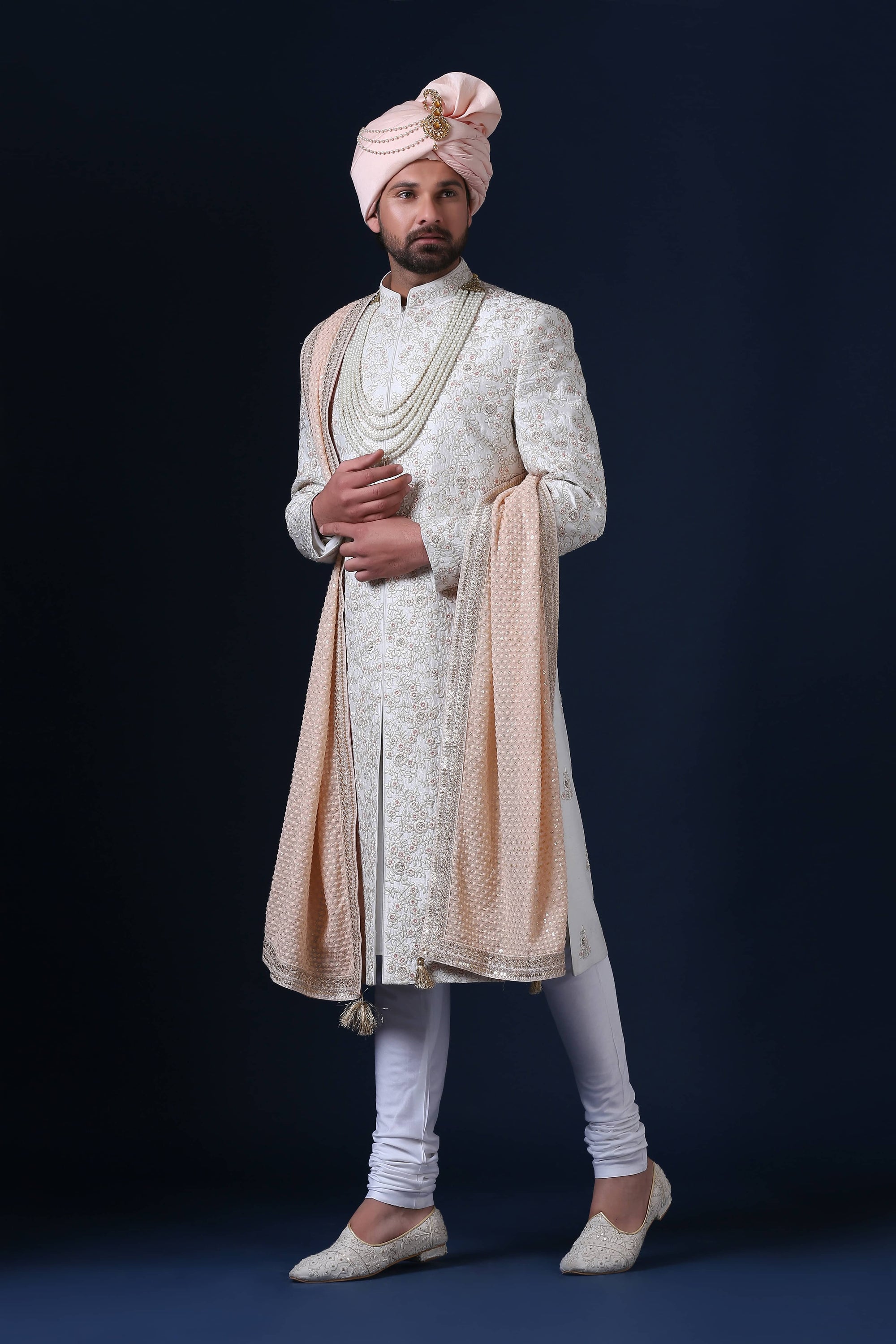 Elegantly adorned with floral embroidery, this Sherwani exudes timeless sophistication. Shop Now!