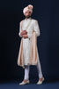 Elegantly adorned with delicate floral embroidery, this white Sherwani exudes timeless sophistication.