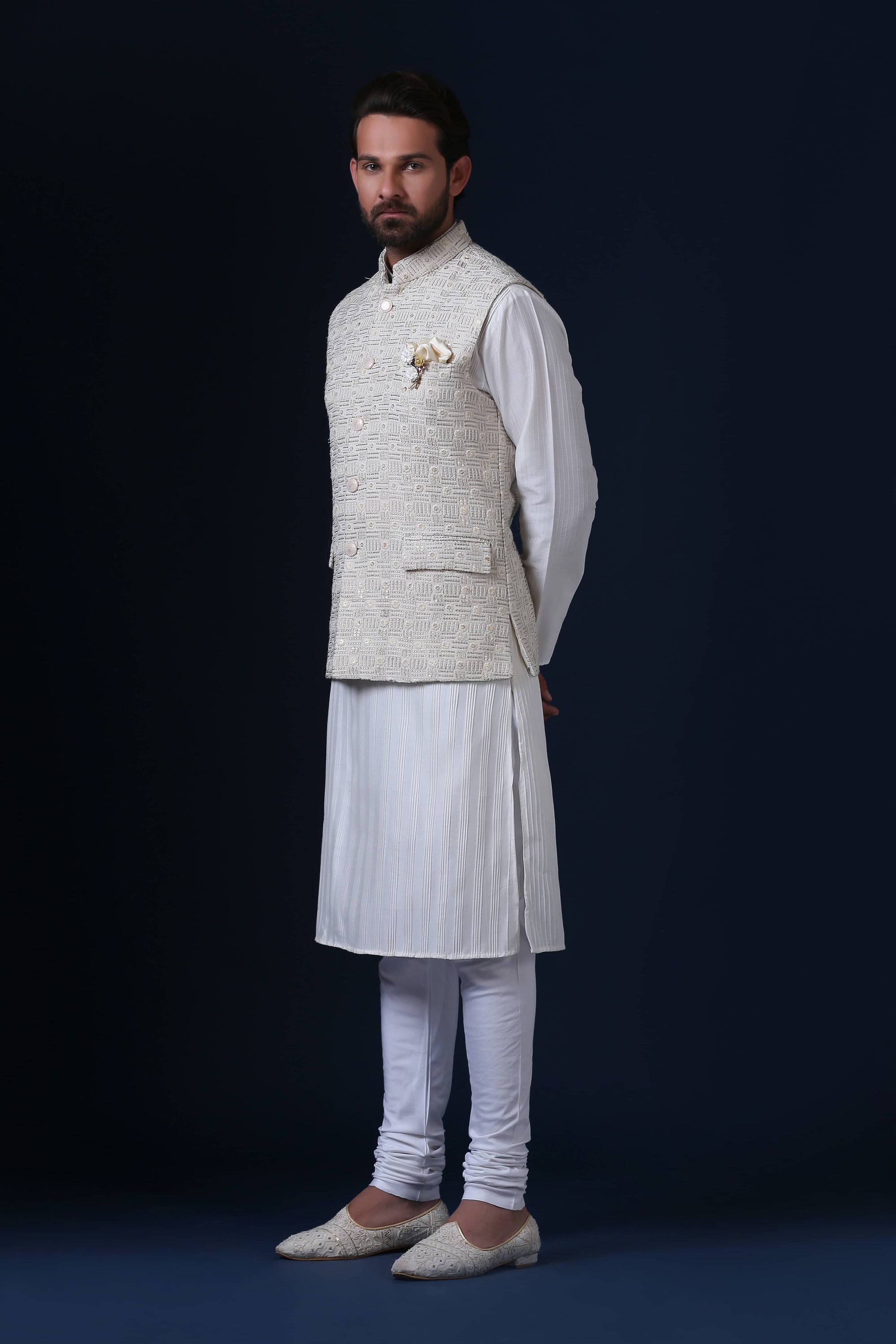 Crafted from luxurious silk jacquard, this jacket shines with pearl-finish buttons. Shop Now!