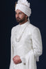 Timeless elegance embodied in this ivory Sherwani, adorned with tonal white embroidery. Complete with Kurta and Pajama. Accessories sold separately.