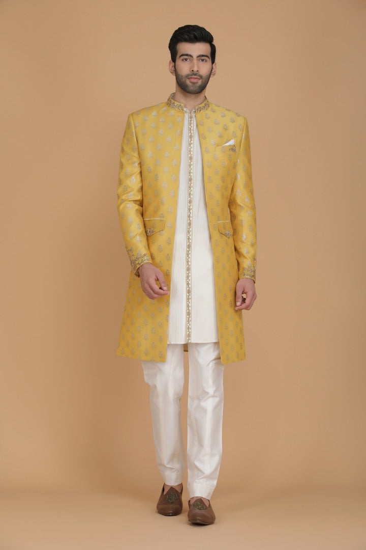 This outfit consists of a front open kurta with detailed embroidery with slim trousers. Shop Now!