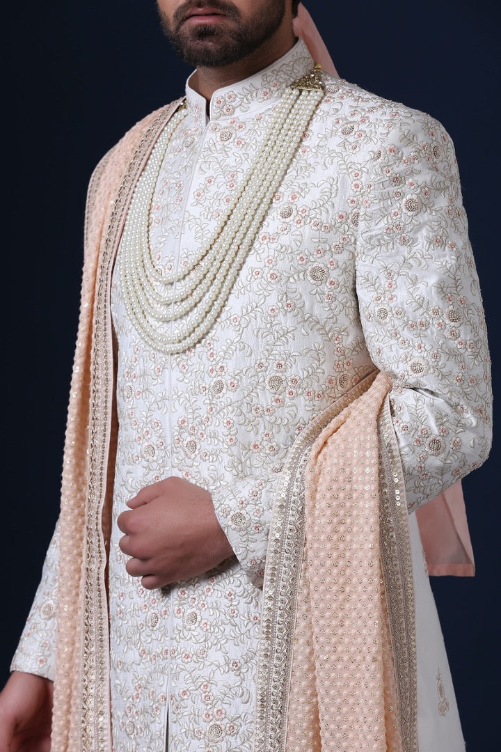 Elegantly adorned with floral embroidery, this Sherwani exudes timeless sophistication. Shop Now!
