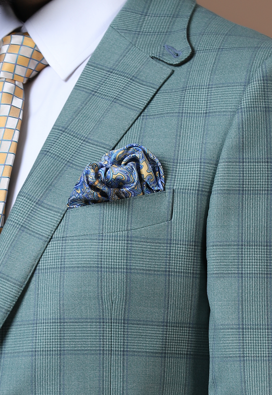 Elevate your ensemble with our two-button, notch lapel suit crafted from 100% wool fabric. Shop Now!